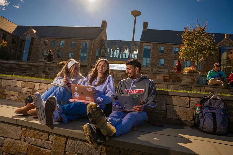 Students gather on the Pioneer Village steps to study, chat, and enjoy the views